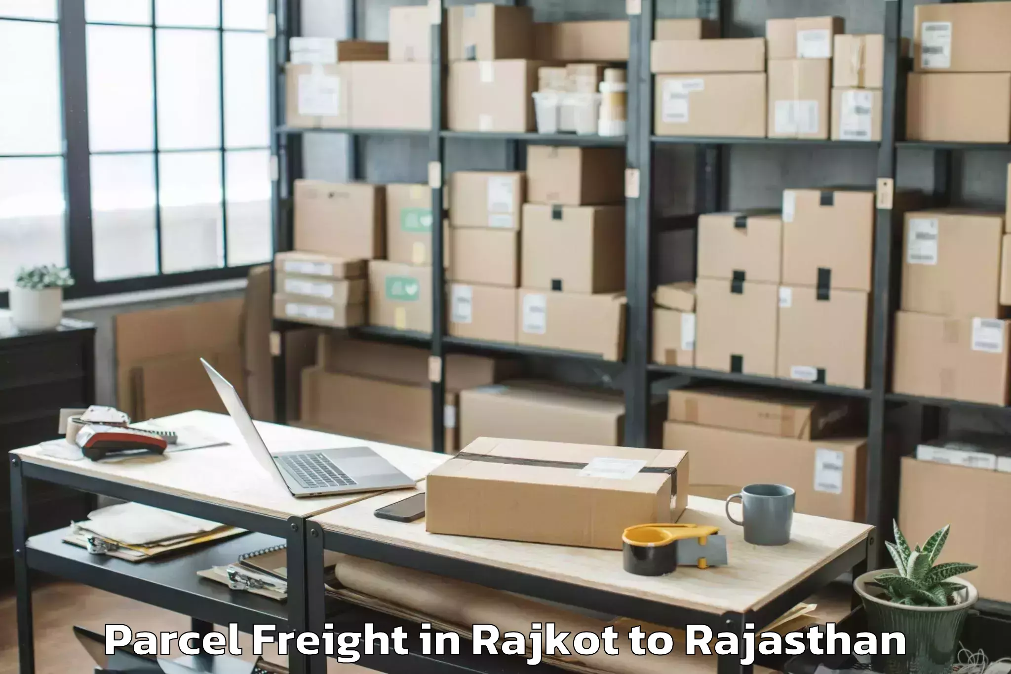 Expert Rajkot to Singhania University Jhunjhunu Parcel Freight